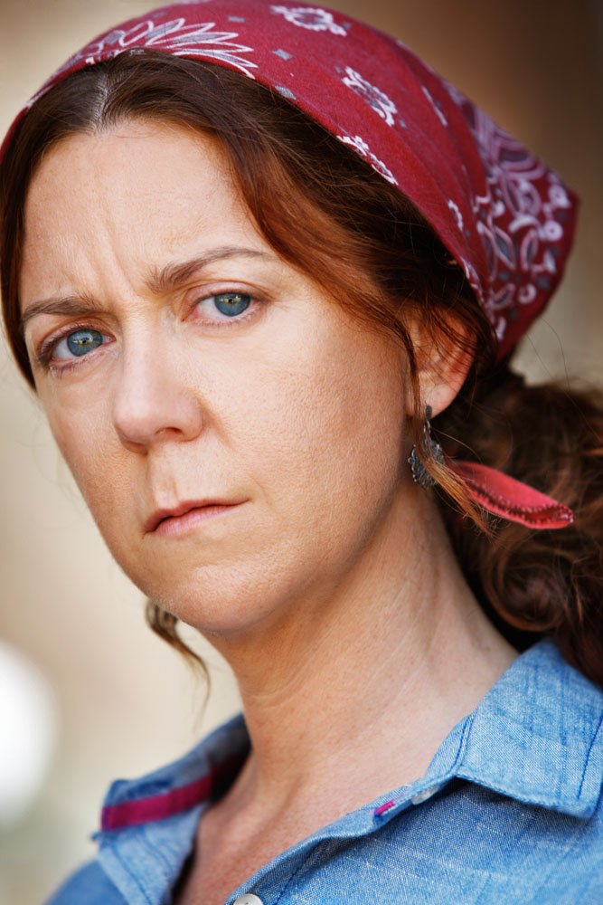 Headshot of Business Gwen, serious with glasses